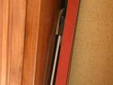 two skis that are sitting on the floor next to a door