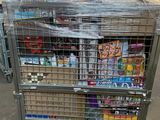 a metal cart with many items in it in a warehouse