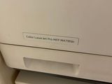 a white printer sitting on top of a white counter top