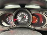 a close up of a car dashboard with various gauges