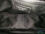 the inside of a black purse with a zipper on it
