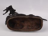 an image of a bronze statue of a horse with a rider on it ' s back