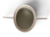 a cup with a handle sitting on a white surface