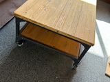 a coffee table on wheels in a living room