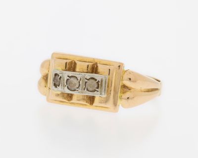 a close up of a gold and diamond ring on a white background