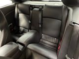 the back seats of a car are black with red trims