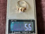a gold ring sitting on top of a digital scale