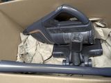a box with a vacuum and a hose inside of it