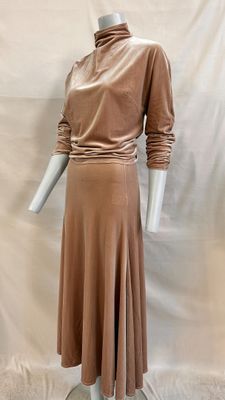the mannequin is wearing a brown dress on a white mannequin