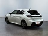the rear end of a white car in a white room
