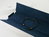 the bracelet is in a blue box with a gold clasp