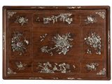 an image of a wooden tray with flowers and birds on it