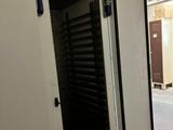 a white machine that is sitting in the middle of a room