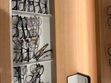 many glasses on the shelves in the room