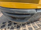 a close up of the front of a yellow truck