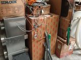 a pile of boxes and other items on the floor