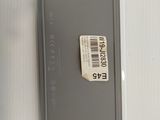 a label on the back of a laptop with a barcode on it