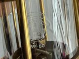 a close up of a brass lantern with a glass cover