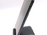 a close up of a cell phone on a stand