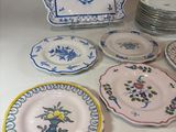 a lot of plates that are sitting on a table