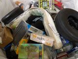 a trash can filled with assorted items in it