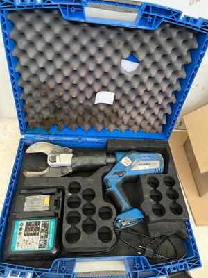 a blue box with tools inside of it on the floor