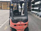a forklift truck that is parked in a parking lot