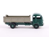 a toy truck that is sitting on a white surface