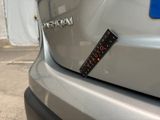 a sticker on the back of a silver car