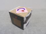a cardboard box with a purple headphone on top of it