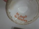 a person holding a cup that has a name on it
