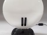 a white light that is on a black base