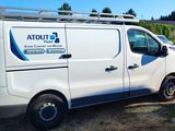 a white van that is parked in the grass