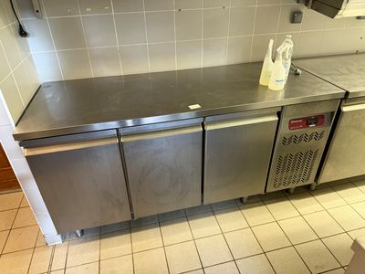 a stainless steel counter in a kitchen with a lot of counter space