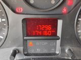 a digital clock on the dashboard of a car
