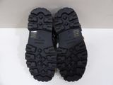 pair of black hiking boots on a white surface