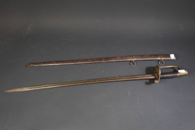 pair of swords with wooden handle and brass fittings on a black surface
