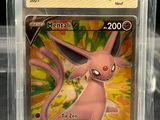 a close up of a pokemon card in a plastic case