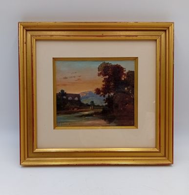 une image d'un tableau représentant un paysage dans un cadre doré