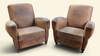 Paire de fauteuils Club en cuir couleur caramel ou havane.