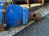 a blue fire hydrant sitting on the side of the road