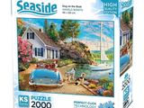 boîte de puzzle représentant une maison et un bateau sur l'eau