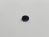 an image of a small black stone on a white surface