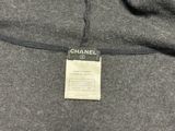a close up of a chanel label on a sweater