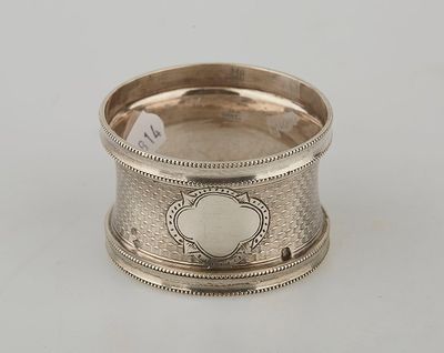 a close up of a silver ring with a heart on it