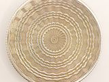 an image of a white plate with a circular design on it