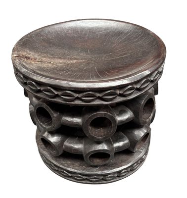 a wooden stool that has a wooden top on it
