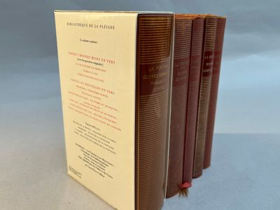 three books are stacked on top of each other on a table