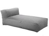 a gray bean bag lounger with a pillow on top of it
