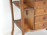 a wooden desk with drawers and a shelf on it